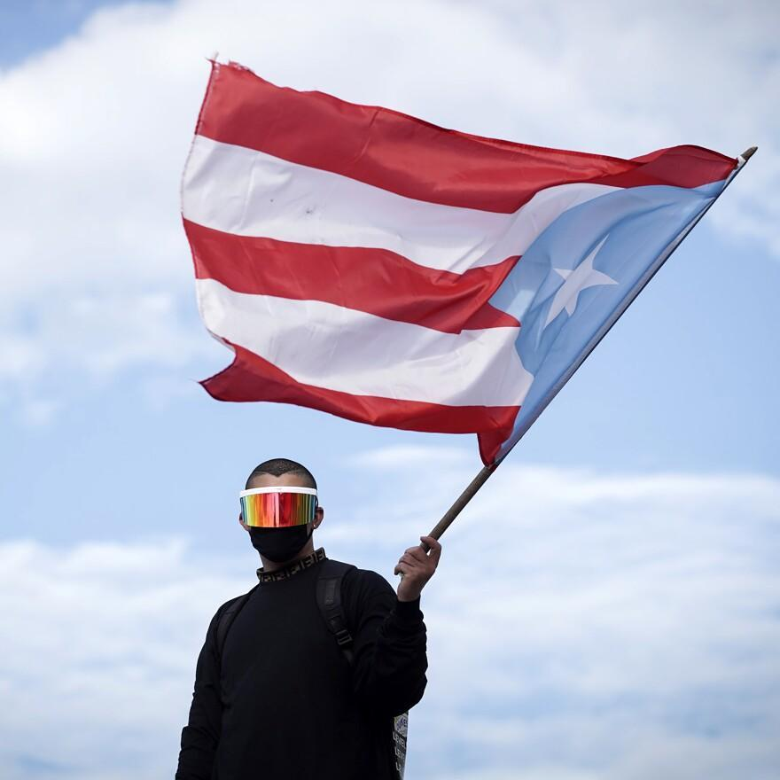 Bad Bunny, photographed while taking part in a demonstration demanding Puerto Rican Governor Ricardo Rossello's resignation in San Juan on July 17, 2019.